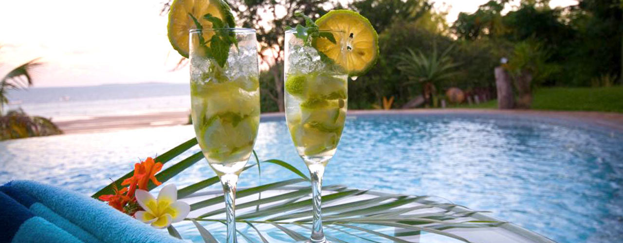 A relaxed cocktail by the pool at Casa Rex Boutique Hotel in Vilanculos, Mozambique
